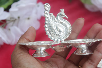 peacock with 2 side diya,  peacock with 4 haladi kumkum holder german silver return gifts, wedding favo golu pooja favors, varalakshmi gifts